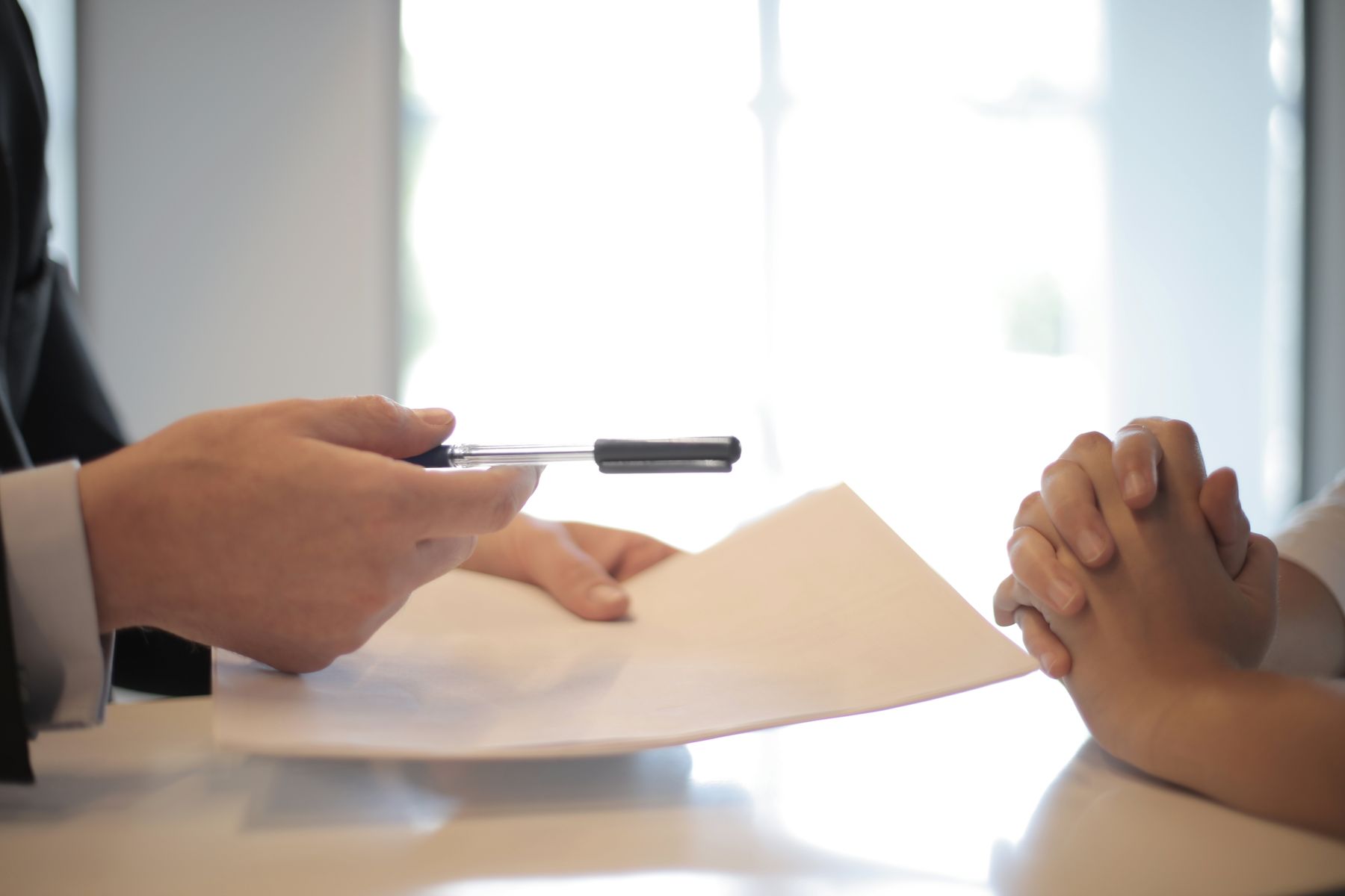 Client consultation reviewing project documents